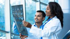 Healthcare workers looking at an X-ray Healthcare workers looking at an X-ray