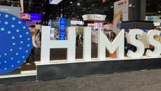 HIMSS Global Health Conference and Exhibition sign and floor exhibits HIMSS Global Health Conference and Exhibition sign and floor exhibits