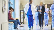 Hospital staff walking in hallway Hospital staff walking in hallway