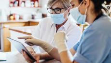 Healthcare worker with tablet Healthcare worker with tablet