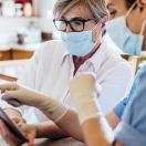 Healthcare worker with tablet Healthcare worker with tablet