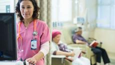 Doctor working in infusion room Doctor working in infusion room