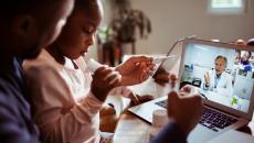 A family using video telehealth A family using video telehealth