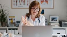 A doctor having a virtual call with a patient A doctor having a virtual call with a patient