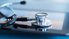 Stethoscope resting on tablet Stethoscope resting on tablet